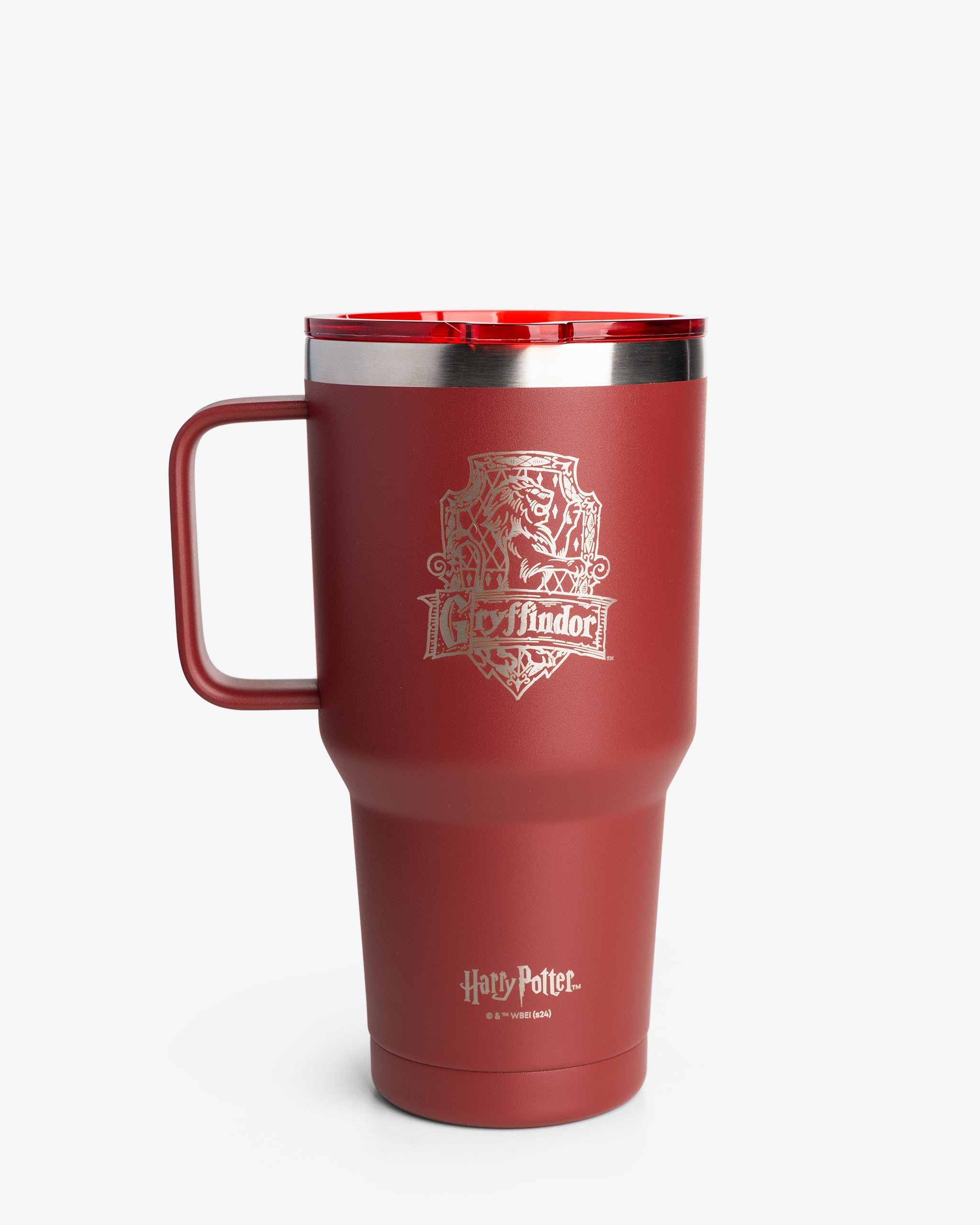 A red insulated nomad tumbler with Gryffindor house crest from Harry Potter, featuring a flared design and a handle.