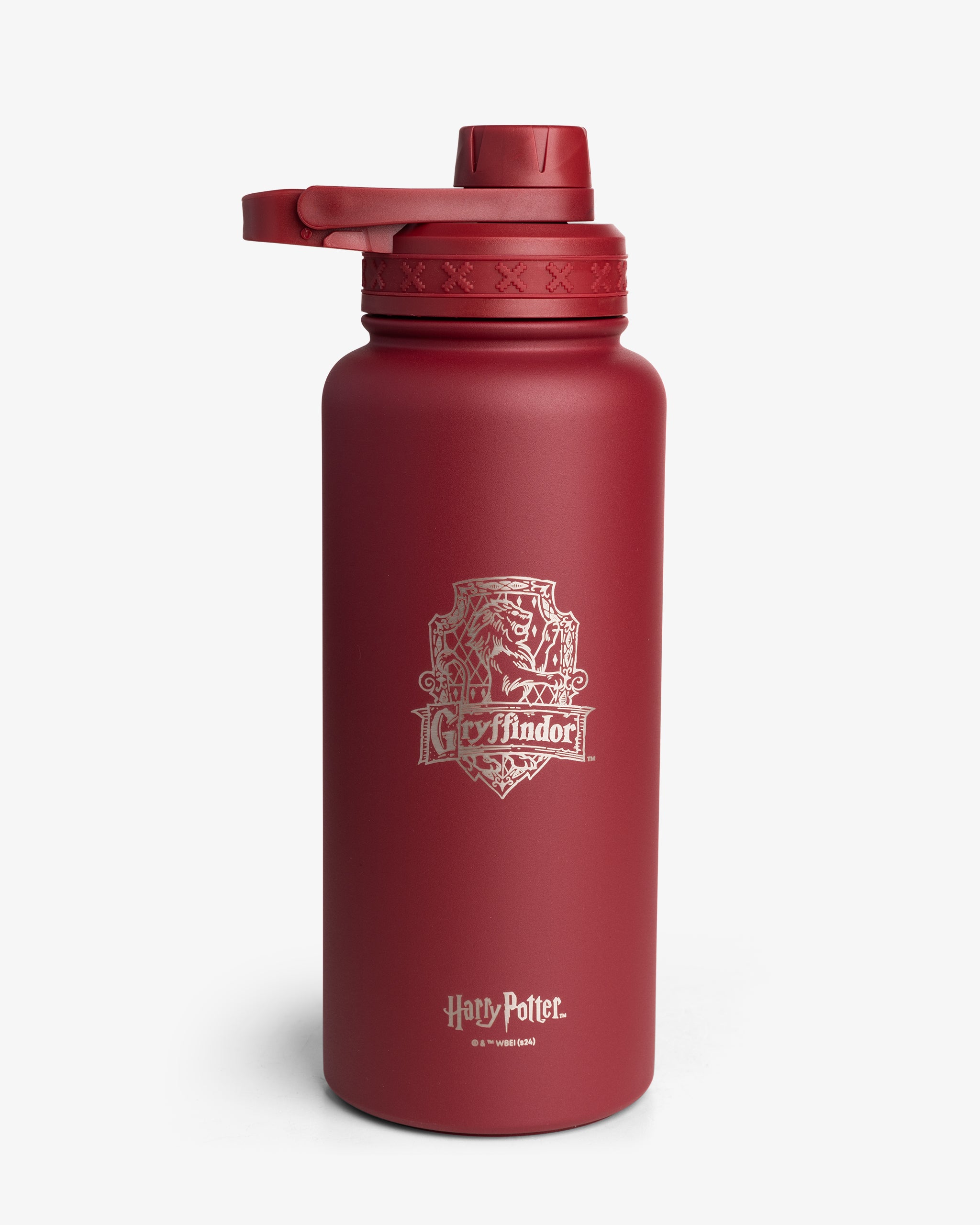 A red insulated sports bottle with the Gryffindor house crest from Harry Potter.